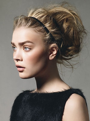 The easy solution to creating an updo for wavy hair is to go for the messy 